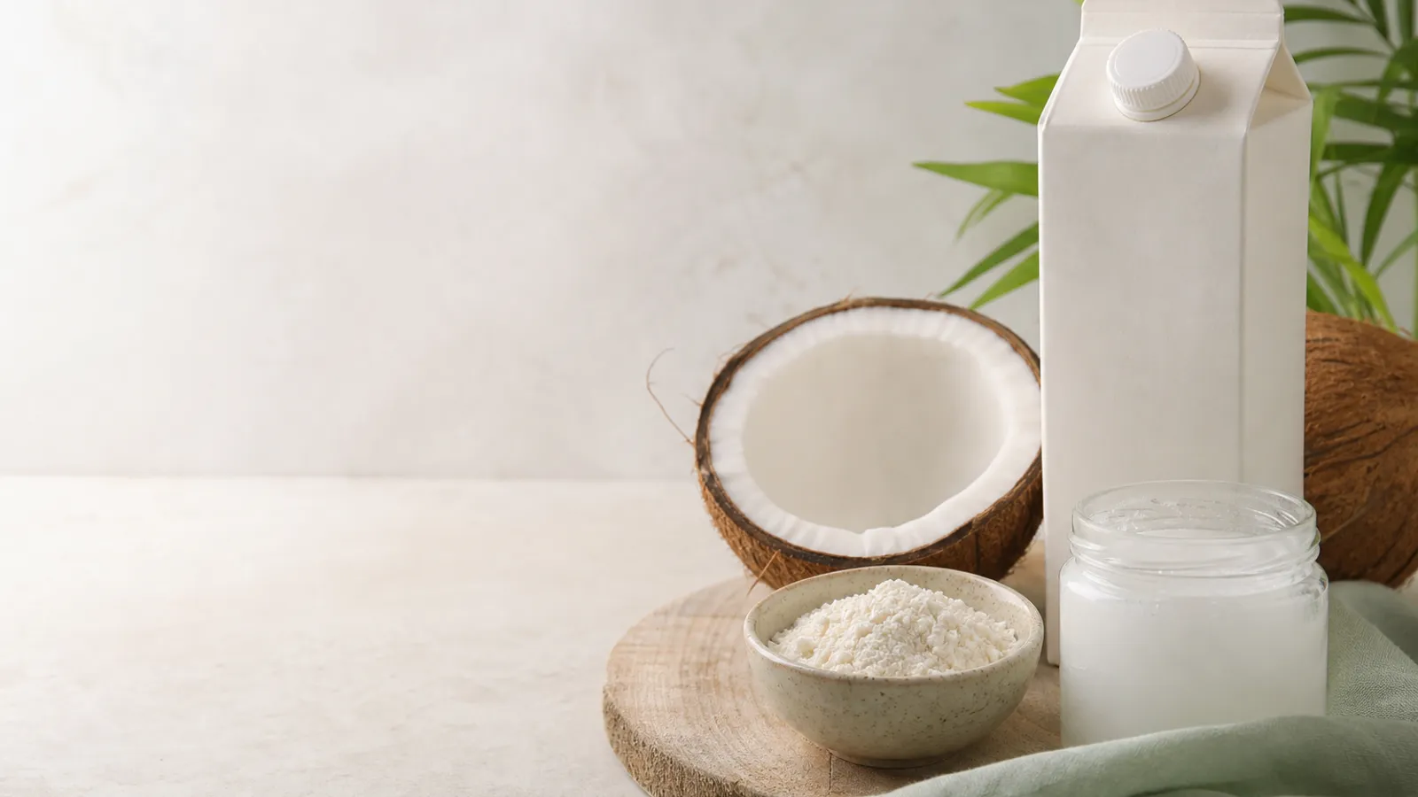 Coconut, coconut flour, and coconut oil on a kitchen counter